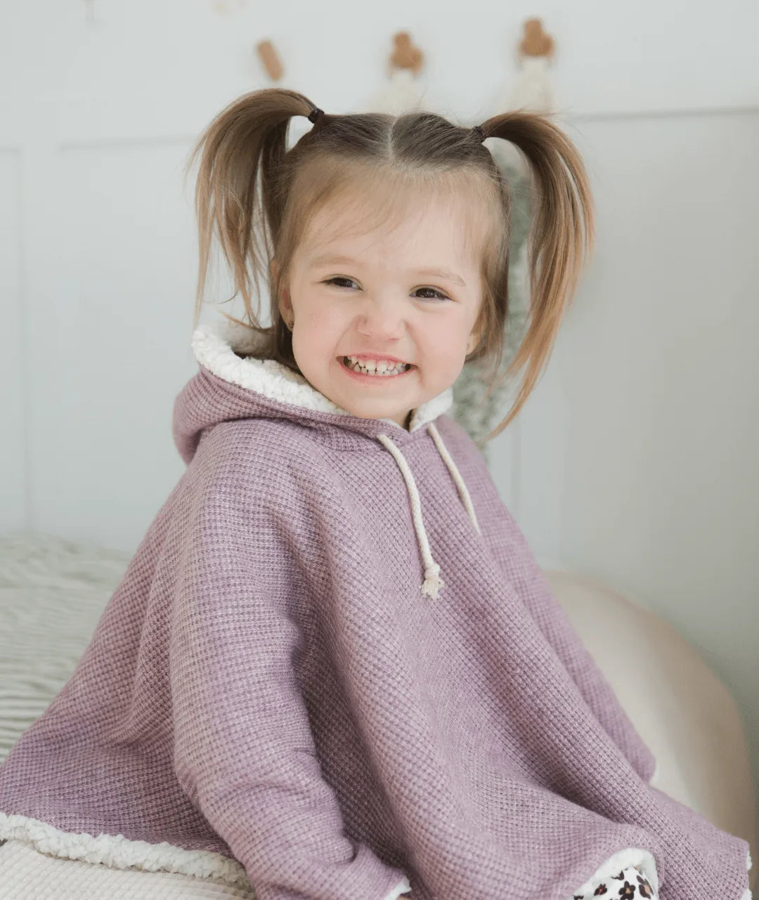 Evolving knitted poncho