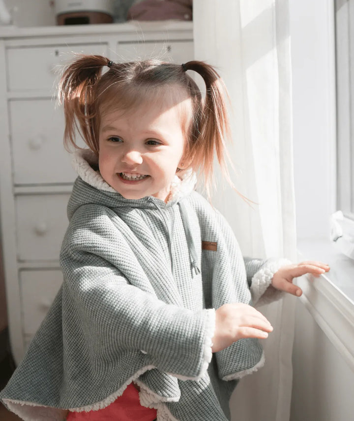 Evolving knitted poncho