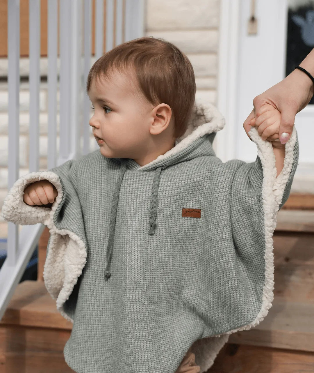 Evolving knitted poncho