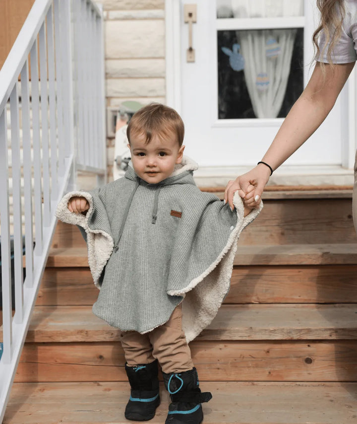 Evolving knitted poncho