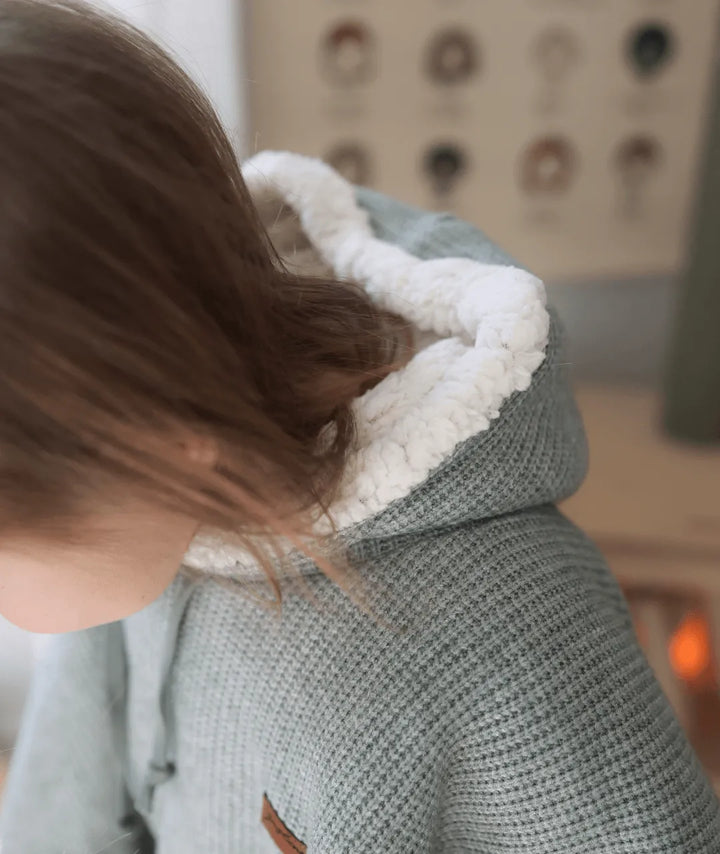 Evolving knitted poncho