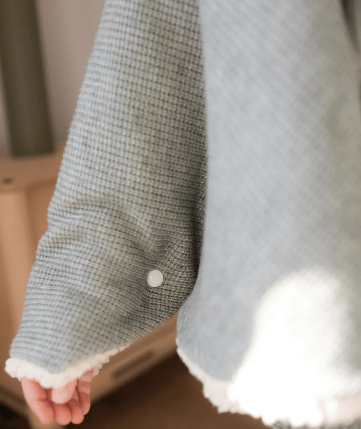 Evolving knitted poncho