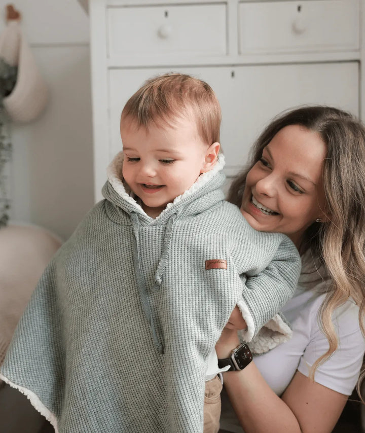 Evolving knitted poncho