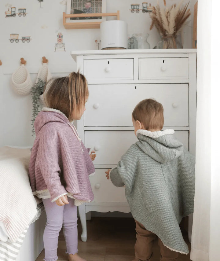 Evolving knitted poncho