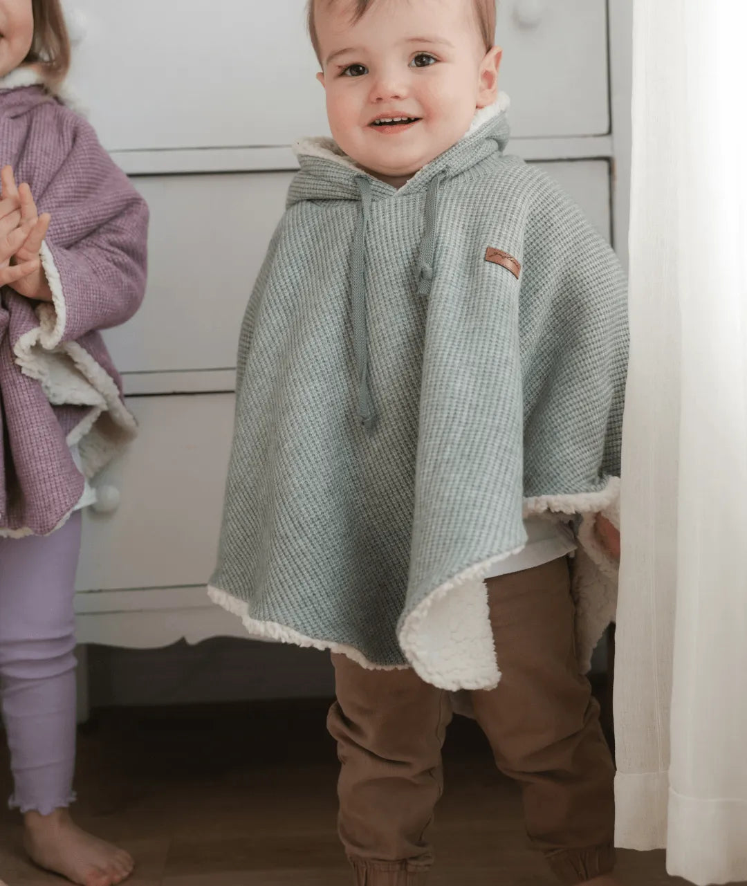 Evolving knitted poncho